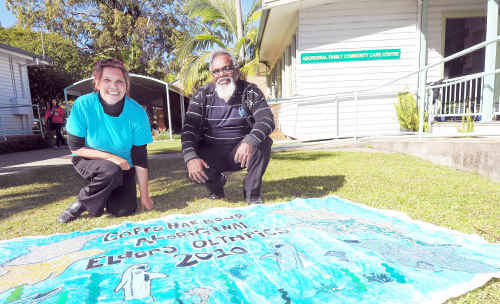 Wendy Craig and Kevin Fergusson, social support co-ordinator, and the Coffs Harbour Aboriginal Elders Olympics banner made with eggshells. Wendy Craig and Kevin Fergusson, social support co-ordinator, and the Coffs Harbour Aboriginal Elders Olympics banner made with eggshells.